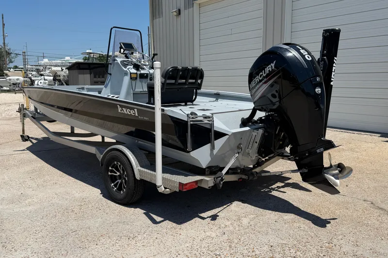 Slide: The Image of 2018 Excel 203 Bay Pro boat with Mercury outboard motor on trailer. - 3