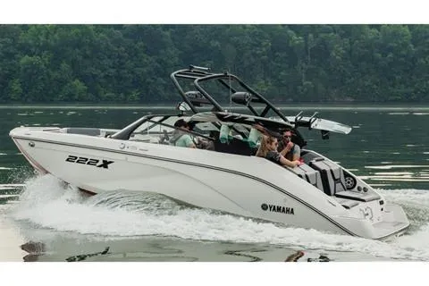 Slide: The Image of 2026 Yamaha Boats 222XD cruising on a lake with passengers enjoying the ride. - 11