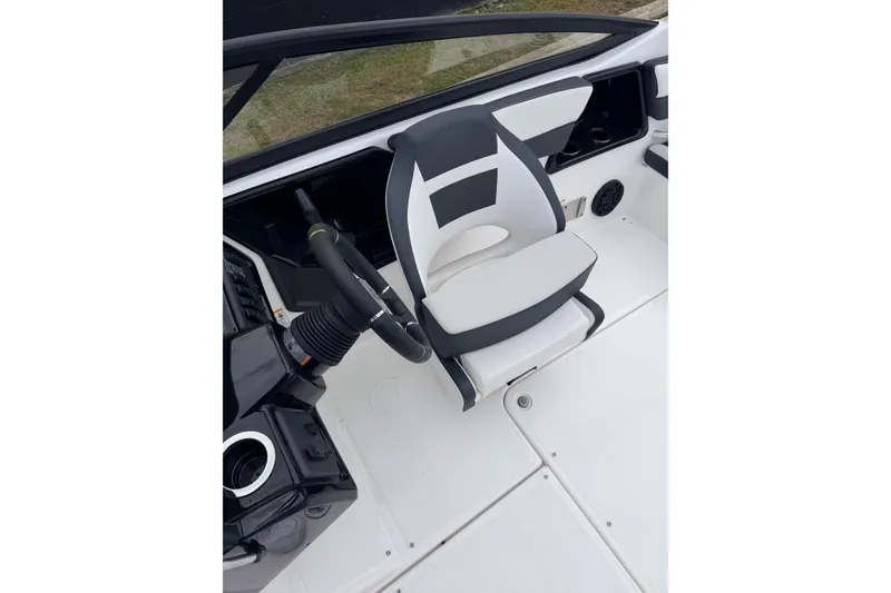Slide: The Image of Interior of Yamaha AR195 boat, 2026 model, featuring steering and seat. - 11