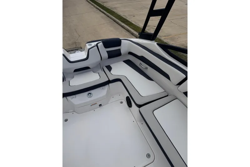 Slide: The Image of Interior of 2026 Yamaha AR195 boat with white and black seating. - 13
