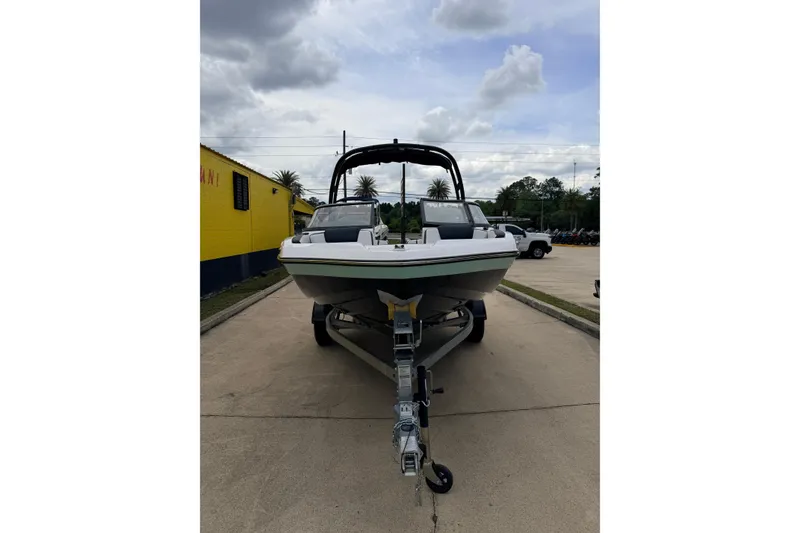 Slide: The Image of Yamaha AR195 2026 boat on trailer, front view under cloudy sky. - 6