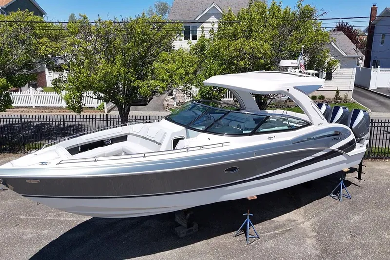 The Image of 2023 Formula 350 Crossover Bowrider OB on display, parked outdoors. - 0