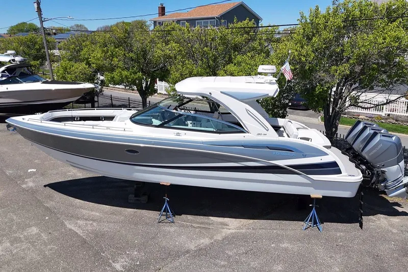 Slide: The Image of 2023 Formula 350 Crossover Bowrider OB on display, featuring sleek design and powerful outboard engines. - 2