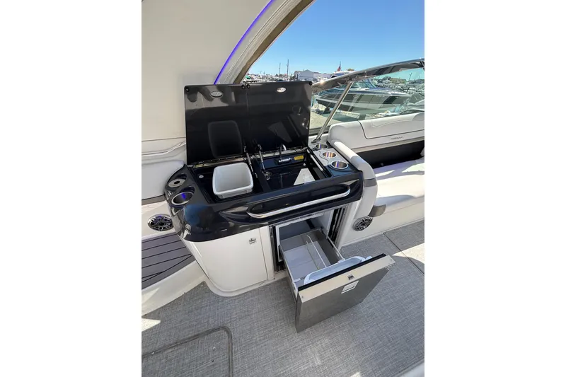 Slide: The Image of 2023 Formula 350 Crossover Bowrider OB interior with open storage and sleek design. - 21