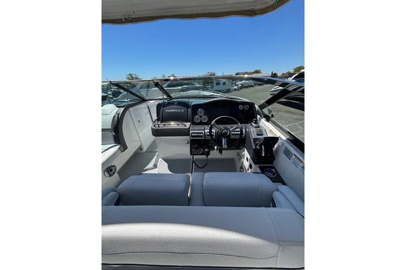 Slide: The Image of 2023 Formula 350 Crossover Bowrider OB cockpit with modern controls and seating. - 23