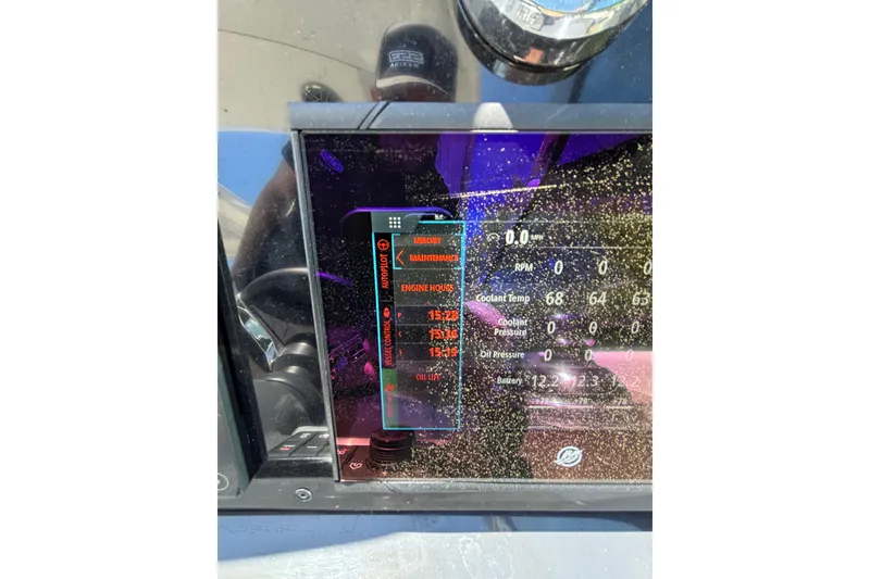 Slide: The Image of Dashboard of 2023 Formula 350 Crossover Bowrider OB displaying engine metrics and maintenance alerts. - 26