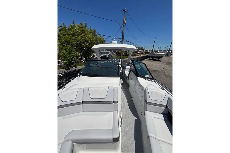 Slide: The Image of 2023 Formula 350 Crossover Bowrider OB, sleek design, spacious seating, outdoor setting. - 30
