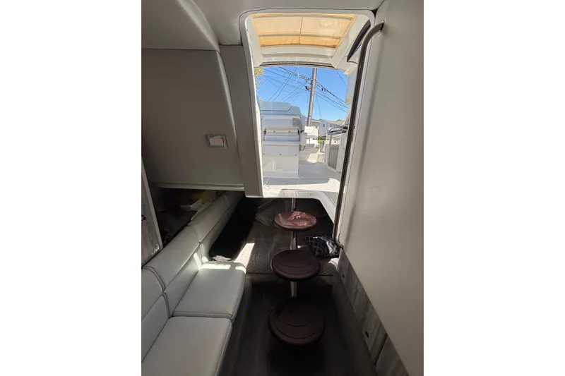Slide: The Image of Interior view of 2023 Formula 350 Crossover Bowrider OB, showcasing seating and cabin access. - 36