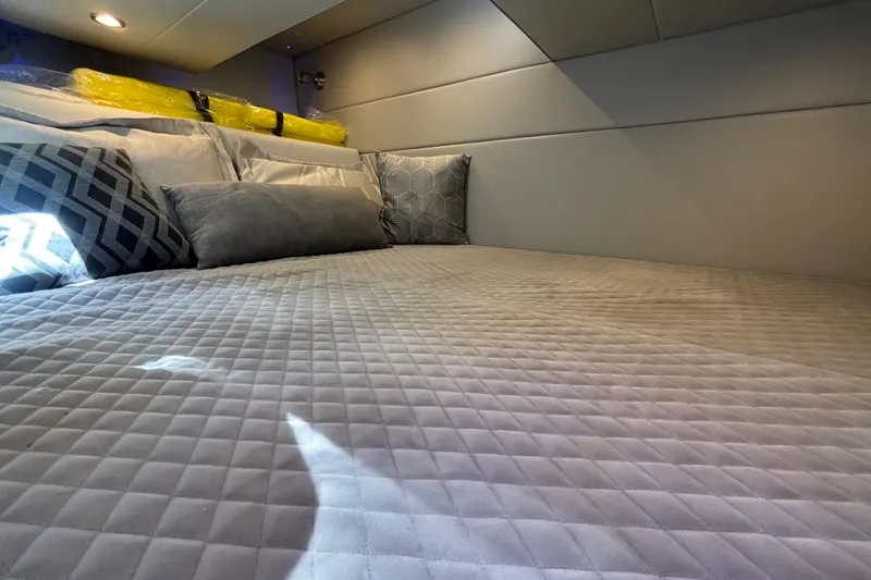 Slide: The Image of Luxurious cabin interior of 2023 Formula 350 Crossover Bowrider OB with plush bedding. - 38