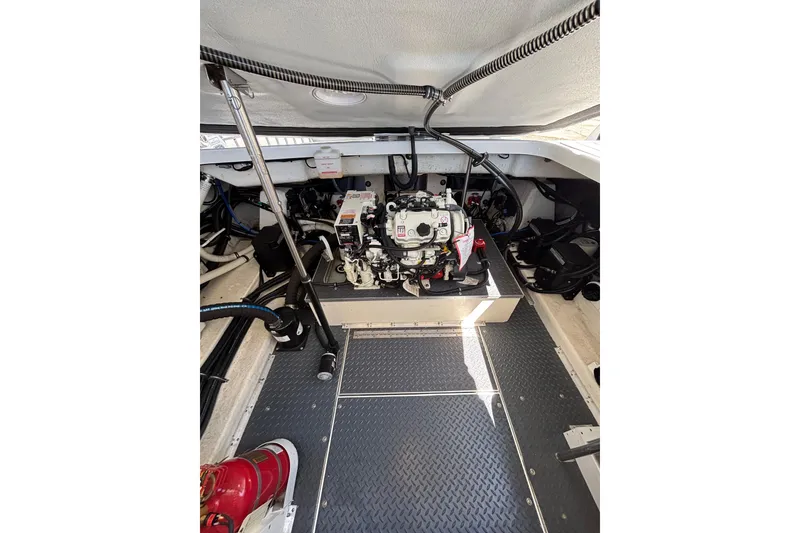 Slide: The Image of Engine compartment of 2023 Formula 350 Crossover Bowrider OB, showcasing mechanical components. - 43