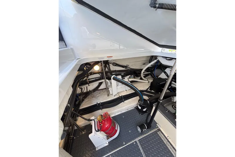Slide: The Image of Engine compartment of 2023 Formula 350 Crossover Bowrider OB, showcasing wiring and components. - 44