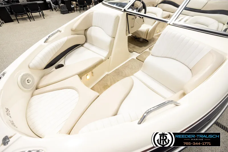 Slide: The Image of 2007 Glastron GXL 205 boat interior with white seating and steering wheel, showcased by Reeder-Trausch Marine. - 10