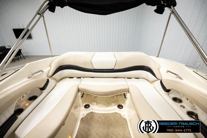 Slide: The Image of 2007 Glastron GXL 205 boat interior with white seating and cup holders. - 18
