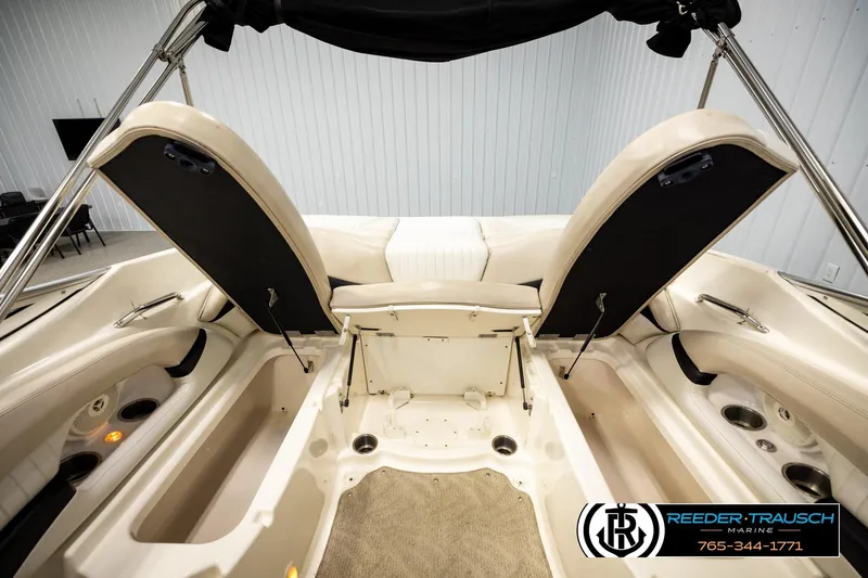 Slide: The Image of 2007 Glastron GXL 205 boat interior with open storage compartments and seating. - 20