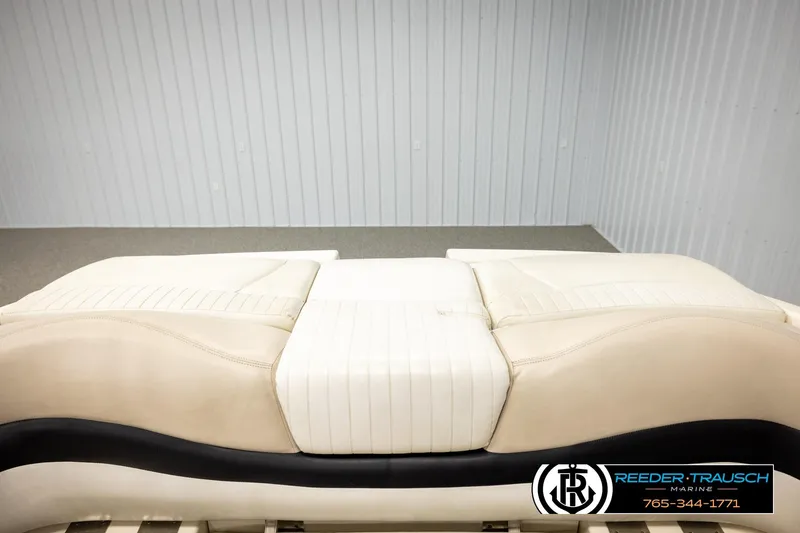 Slide: The Image of 2007 Glastron GXL 205 boat seat in beige upholstery, displayed indoors. - 26