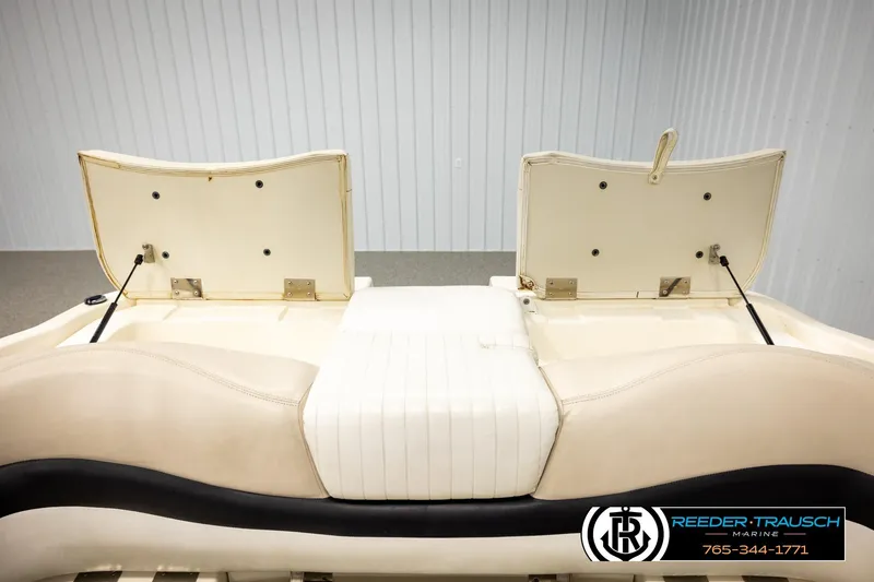 Slide: The Image of 2007 Glastron GXL 205 boat interior seating with open storage compartments. - 28