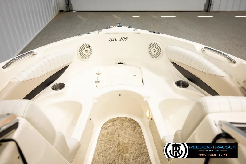 Slide: The Image of 2007 Glastron GXL 205 boat interior with white seating and cup holders. - 30