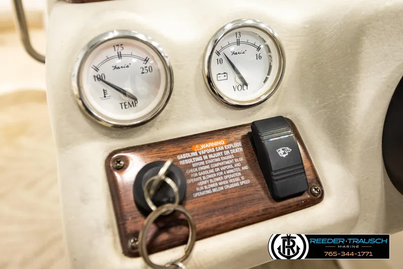 Slide: The Image of Dashboard of 2007 Glastron GXL 205 boat with temperature and voltage gauges. - 35