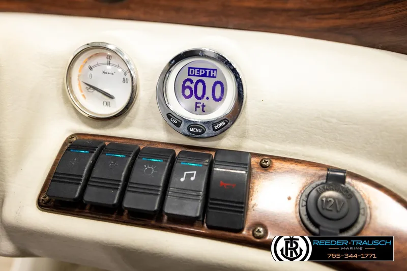 Slide: The Image of Dashboard of 2007 Glastron GXL 205 boat showing depth gauge and controls. - 37
