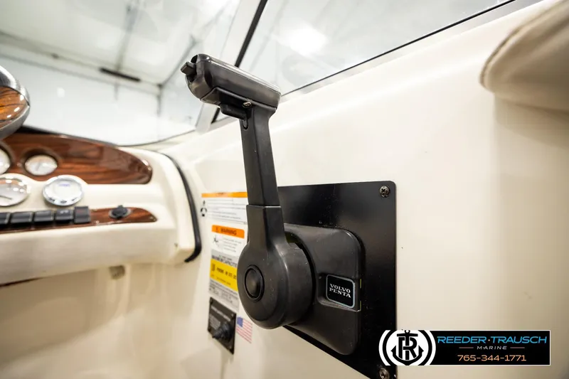 Slide: The Image of 2007 Glastron GXL 205 boat dashboard with Volvo Penta throttle control. - 38