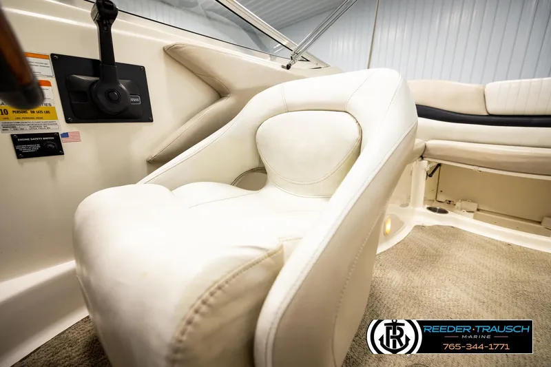Slide: The Image of 2007 Glastron GXL 205 boat interior with white seating and control panel. - 39