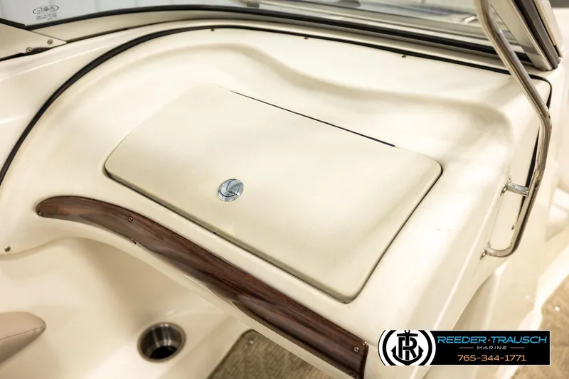 Slide: The Image of 2007 Glastron GXL 205 boat dashboard with beige panel and wood trim. - 41