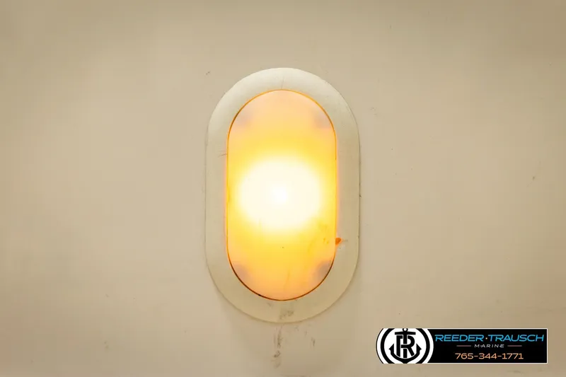 Slide: The Image of Oval-shaped light fixture on a 2007 Glastron GXL 205 boat interior. - 45