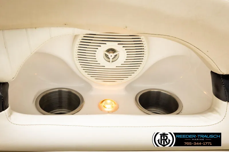 Slide: The Image of 2007 Glastron GXL 205 boat interior with speaker, cup holders, and ambient lighting. - 46