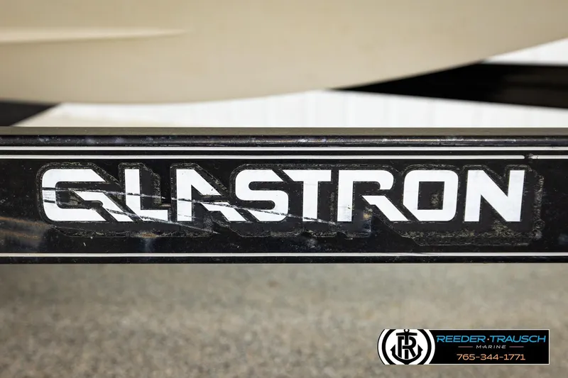 Slide: The Image of Close-up of 2007 Glastron GXL 205 logo on a boat trailer. - 51
