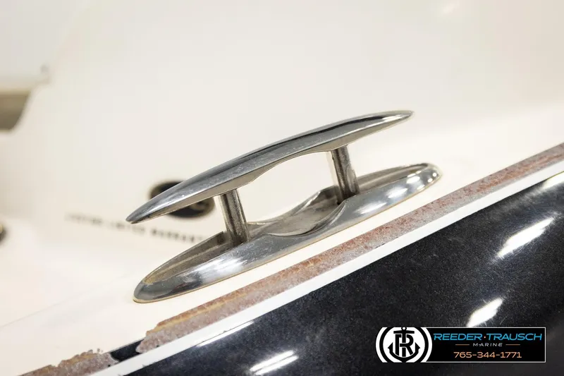 Slide: The Image of 2007 Glastron GXL 205 boat cleat detail with Reeder-Trausch Marine branding. - 56