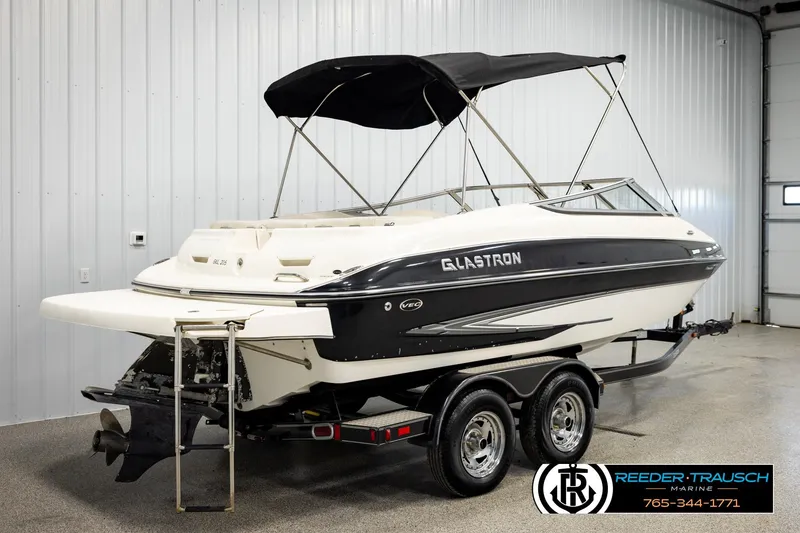Slide: The Image of 2007 Glastron GXL 205 boat on trailer in indoor storage facility. - 6