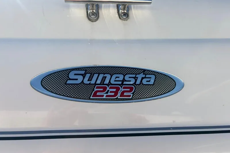 Slide: The Image of Chaparral Sunesta 232 logo on a 2000 model boat, featuring sleek design. - 3