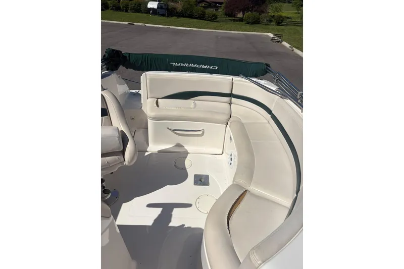 Slide: The Image of 2000 Chaparral Sunesta 232 boat interior with white seating and green accents. - 6