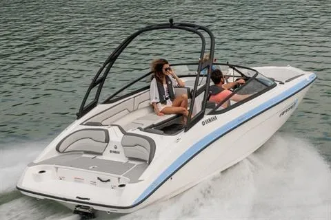 Slide: The Image of 2026 Yamaha Boats AR190 cruising on water with passengers enjoying the ride. - 14