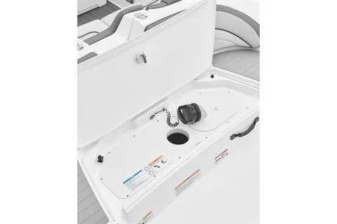 Slide: The Image of 2026 Yamaha Boats AR190 storage compartment with safety labels and equipment. - 6