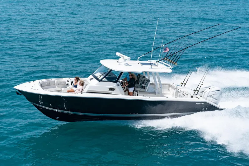 The Image of 2026 Pursuit S 358 Sport boat cruising on open water, equipped with fishing rods. - 0