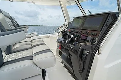 Slide: The Image of 2026 Pursuit S 358 Sport boat interior with modern dashboard and seating. - 13