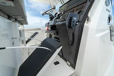 Slide: The Image of 2026 Pursuit S 358 Sport boat helm with modern controls and sleek design. - 14