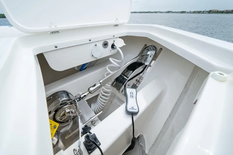 Slide: The Image of Anchor compartment of 2026 Pursuit S 358 Sport boat with control panel. - 18