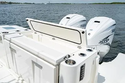 Slide: The Image of 2026 Pursuit S 358 Sport boat with dual Yamaha outboard engines on a calm water backdrop. - 4