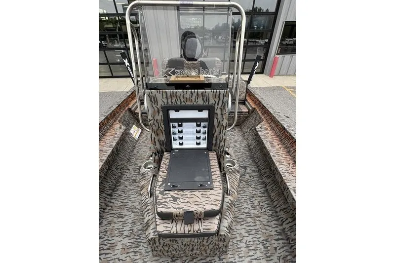 Slide: The Image of 2026 Xpress H22B Bay boat interior with camouflage design and control panel. - 15