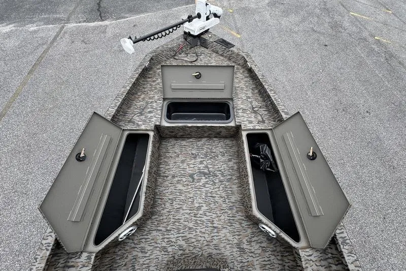 Slide: The Image of 2026 Xpress H22B Bay boat with open storage compartments and trolling motor. - 19