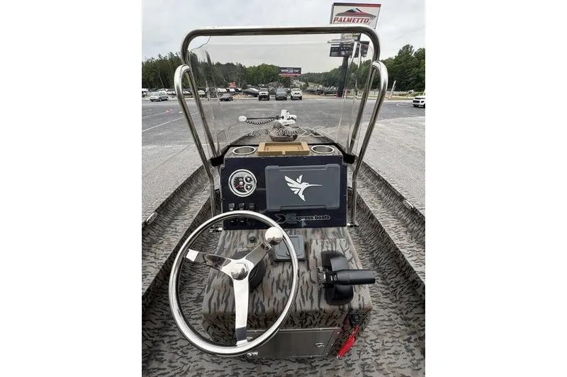 Slide: The Image of 2026 Xpress H22B Bay boat dashboard with steering wheel and controls. - 20