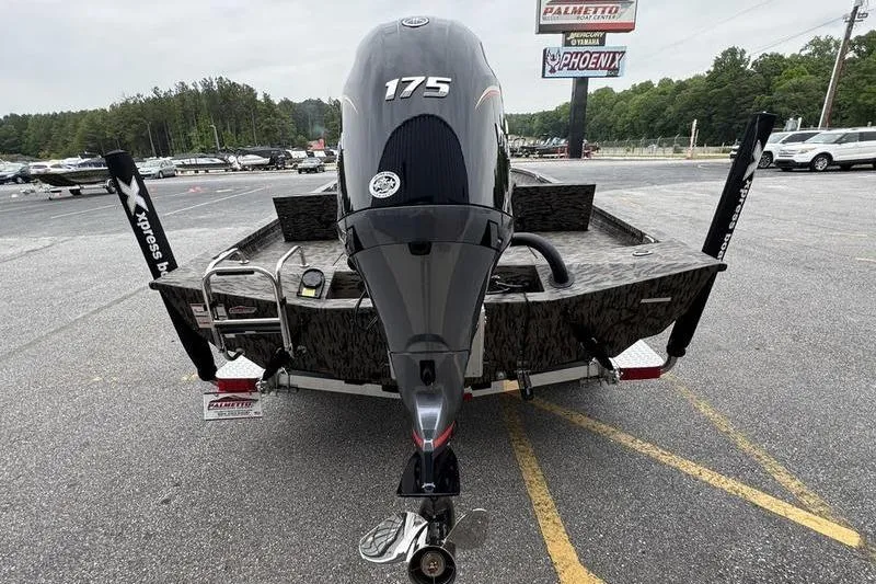 Slide: The Image of 2026 Xpress H22B Bay boat with 175 horsepower engine, parked in a lot. - 3