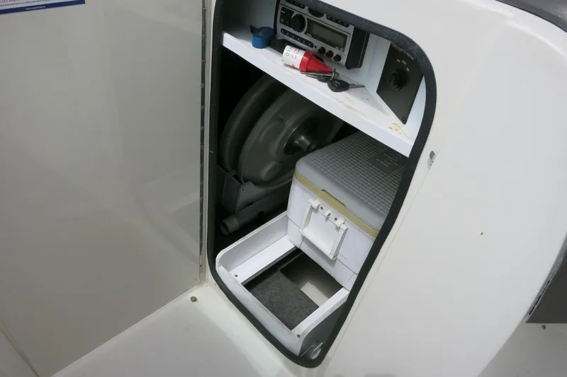 Slide: The Image of Storage compartment in a 2008 Sea Ray 260 Sundeck boat with equipment and cooler. - 13