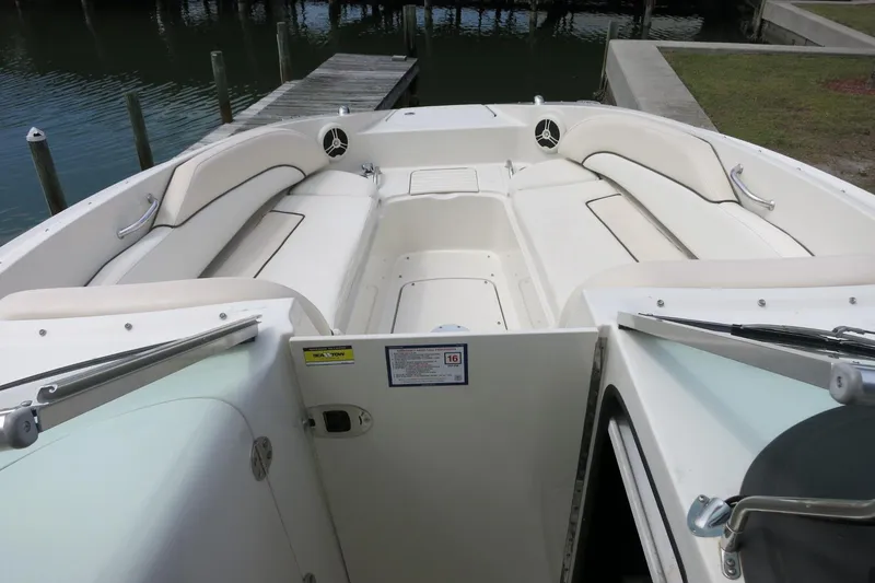 Slide: The Image of 2008 Sea Ray 260 Sundeck boat interior with white seating and open deck layout. - 15