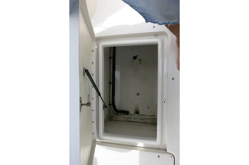 Slide: The Image of Storage compartment of a 2008 Sea Ray 260 Sundeck boat, open and empty. - 27
