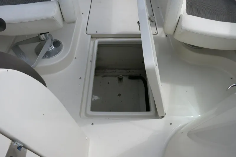 Slide: The Image of Open storage compartment on a 2008 Sea Ray 260 Sundeck boat interior. - 28