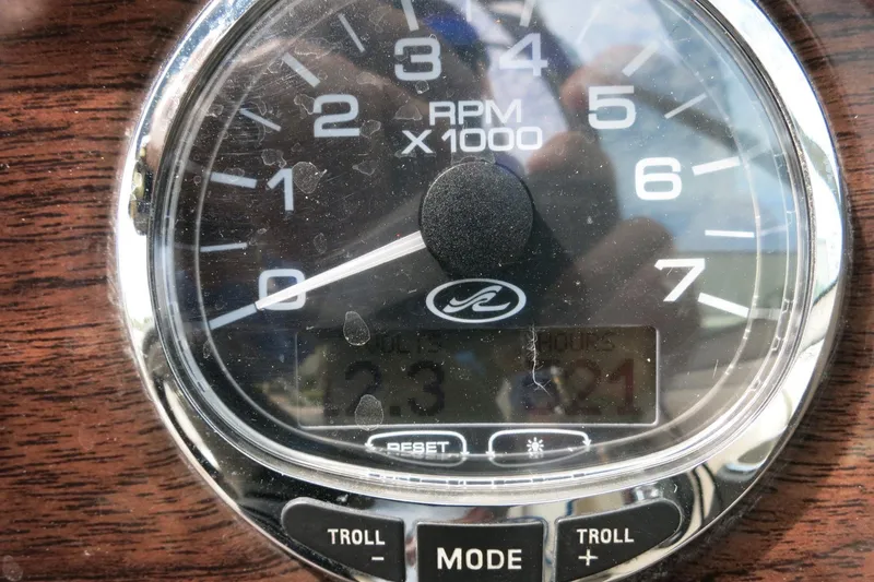 Slide: The Image of Close-up of a 2008 Sea Ray 260 Sundeck tachometer displaying RPM and engine hours. - 35