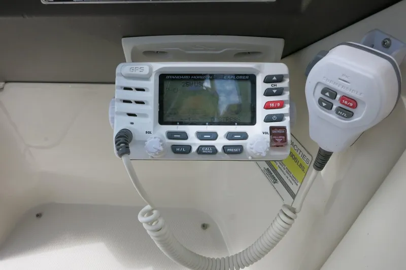 Slide: The Image of VHF radio system on a 2008 Sea Ray 260 Sundeck boat dashboard. - 37